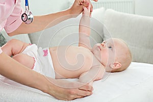 Pediatrician examines baby photo