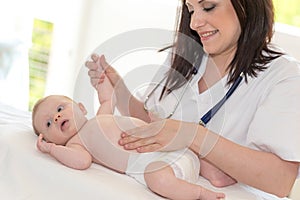 Pediatrician examining baby