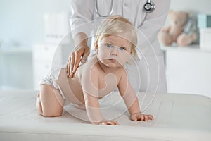 Pediatrician examining baby. Health care