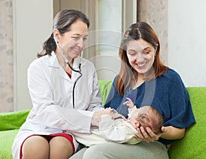 Pediatrician examining newborn baby