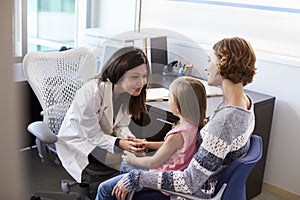 Pediatrician Meeting With Mother And Child In Hospital photo