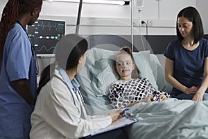 Pediatrist examining sick little girl disease symptoms