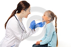 Pediatrist holding stick near child with photo
