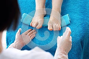 Pedicure in a beauty salon. foot disinfection with an antibacterial agent.