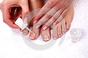 Pedicure on legs and beautiful manicure on hands
