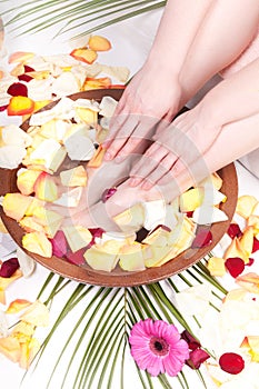 Pedicure and manicure spa with petals and flowers