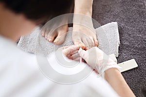 Pedicure. Nail clipping, foot care, female feet during a pedicure at a beauty salon.