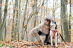 Pedigree dog concept. Wild in soul. Best friends. Girl enjoy walk with husky dog. Girl pretty stylish woman walking with