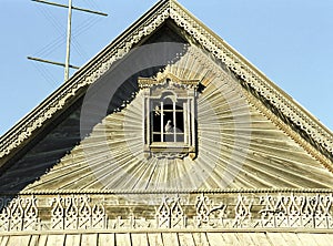 Pediment with decor. Part of an old Russian wooden house.