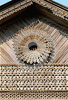 Pediment with decor. Part of an old Russian wooden house.