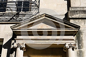 The pediment of a doorway on Brock Street, Bath with engaged Ionic columns photo