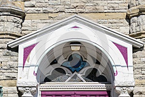 Pediment and stained glass transom window