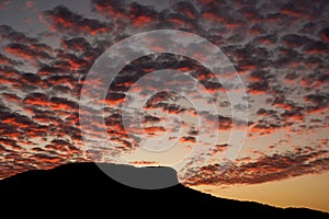 Pedra Branca neighborhood, Palhoca, Brazil with silhouette of the hill, sky at sunset with colorful clouds, infinity of colors in