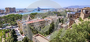 Pedro Luis Alonso gardens, the Town Hall building and tha Alcazaba in Malaga, Spain.