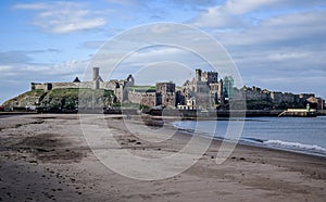 Peel Castle as seen from the beach at the entrance to Peel harbour, Isle of Man