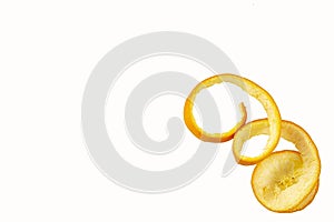 The peel is coiled isolated on a white background. Tropical fruit