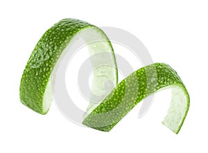 Peel of fresh ripe lime isolated on white background. Lime fruit peel. Skin of green lime. Selective focus