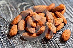 Peeled almonds close-up on wooden table