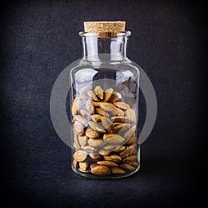 Peeled almonds in a glass jar