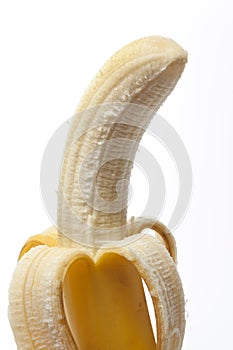 Peeled banana with a skin