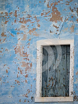 Peeled blue window wall