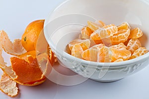 Peeled clementines in bowl