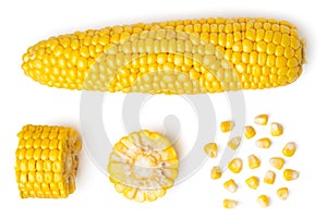 The peeled ear of corn, a piece of and seeds on a white, isolated. The view from the top.