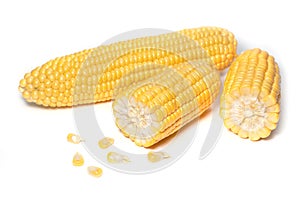 The peeled ear of corn, a piece of and seeds on a white, isolated