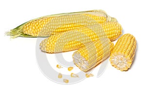 The peeled ear of corn, a piece of and seeds on a white, isolated