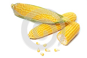 The peeled ear of corn, a piece of and seeds on a white, isolated