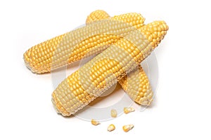 The peeled ear of corn, a piece of and seeds on a white, isolated