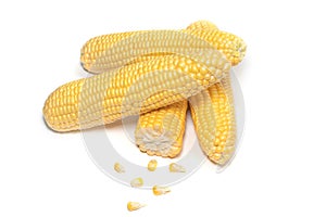 The peeled ear of corn, a piece of and seeds on a white, isolated