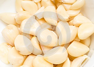 Peeled garlic as background
