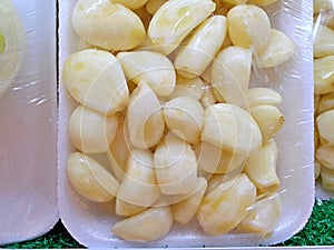Peeled garlic bulb on sale