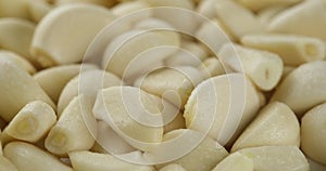 Peeled garlic top view rotate