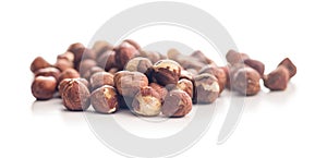 Peeled hazelnut kernels isolated on white background