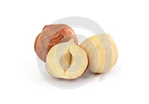 Peeled hazelnuts on a white background