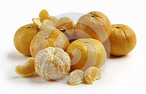 Peeled mandarin with segments and whole mandarins