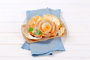 Peeled orange arranged in peels