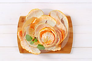 Peeled orange arranged in peels