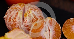 peeled , orange tangerines on the table in close-up