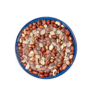 Peeled peanuts for background. Roasted peanut beans with skins. Isolated in a blue plate on a white background