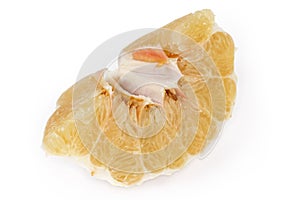 Peeled piece of ripe pomelo on a white background