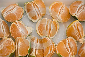 Peeled and Pieced Green Mandarins on Table