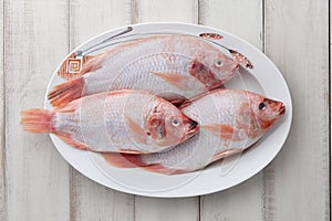 Peeled red tilapia in dish plate