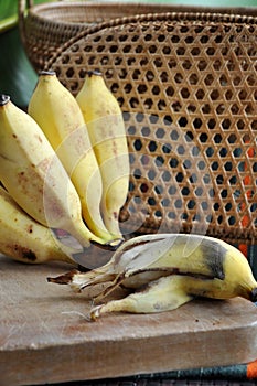 Peeled rotten banana on board