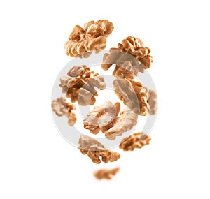 Peeled from the shell, walnut kernels levitate on a white background