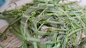 Peeled skin of bottle gourd spinach on the floor at home in Dhaka, Bangladesh