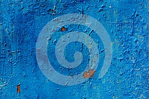 Peeling blue paint on a metal surface texture background