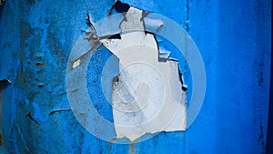 Peeling Blue Wall with Light Surface